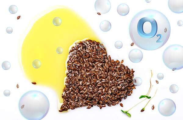 semillas de lino en forma de corazon con aceite de linaza derramando y bolas de oxigeno o2
